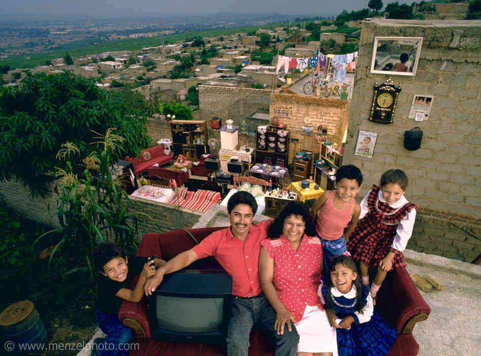 The Castillo Balderas family of Guadalajara, Mexico, outside their home with all of their possessions. 