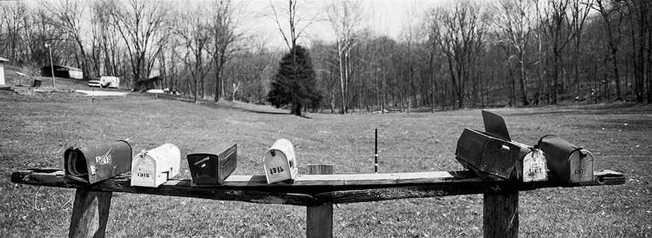 Mailboxes at the end of Old Salem Road in Utica, Ind. This small two-lane road will be converted into the arterial road that will lead to a new highway.