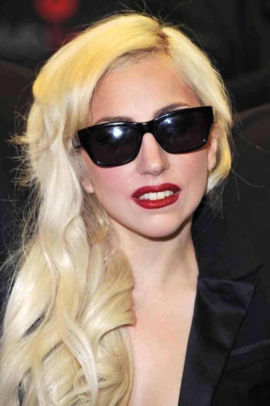 Lady Gaga toned down, but still not wearing her real hair. 