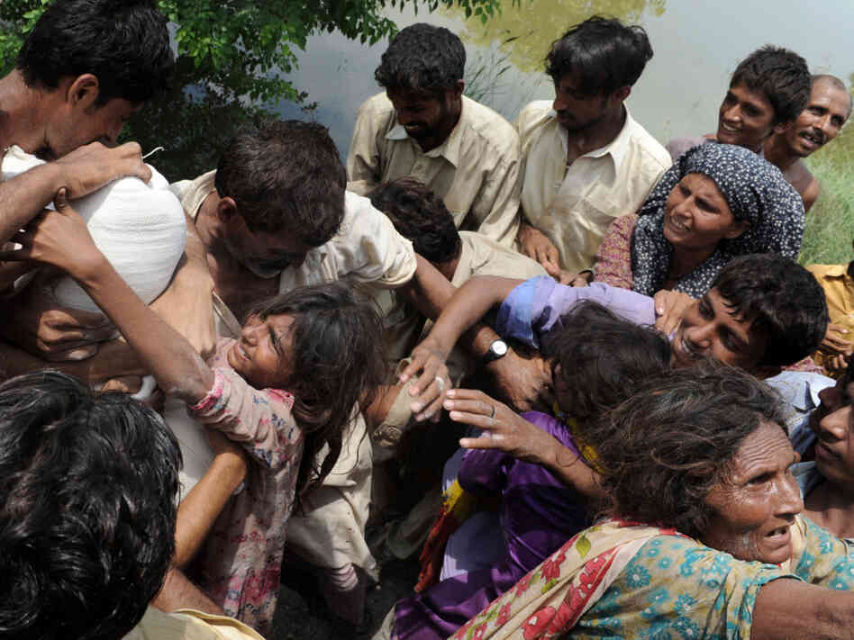 Pakistani flood survivors struggle for a Pakistani flood survivors struggle for a