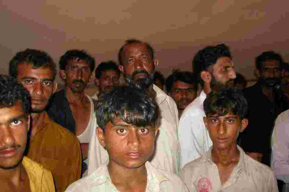 Haggard and hungry, villagers from Shahgar wait for food aid to arrive. Assistance has come mostly from private citizens who organize aid deliveries with their own trucks, money and meals.  Anger is rising against the government among people are who impoverished even in the best of time, but who have now lost everything.
