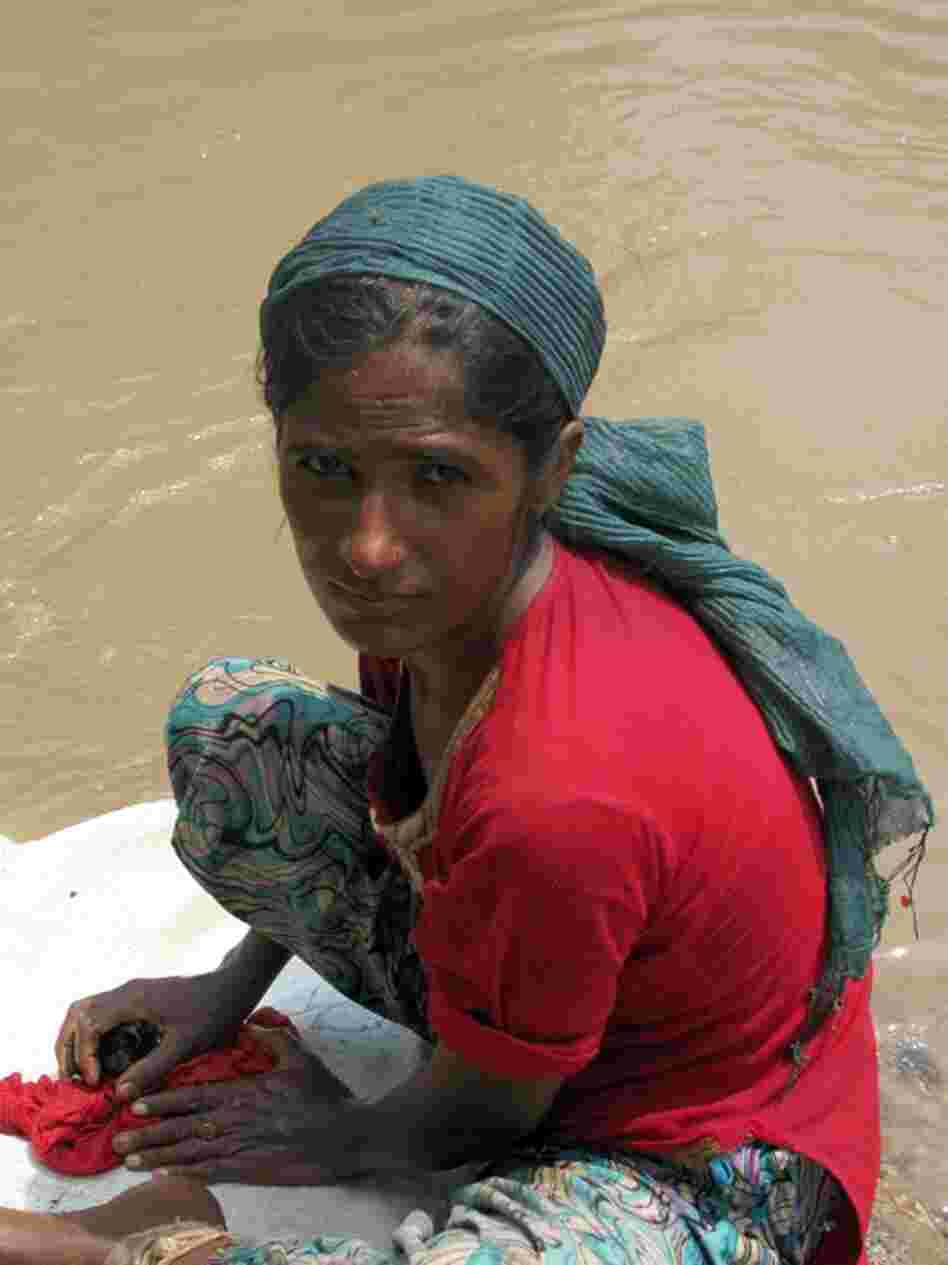 Tasleem Mai, 25, was washed out of her home near Muzaffargarh when the Indus River reached levels not seen in living memory. She now lives on the edge of the water-logged road with her four children. Most flood victims have not gone to camps, but are staying near their homes to ensure against theft.