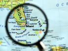 Miami map under a magnifying glass. Miami map under a magnifying glass.