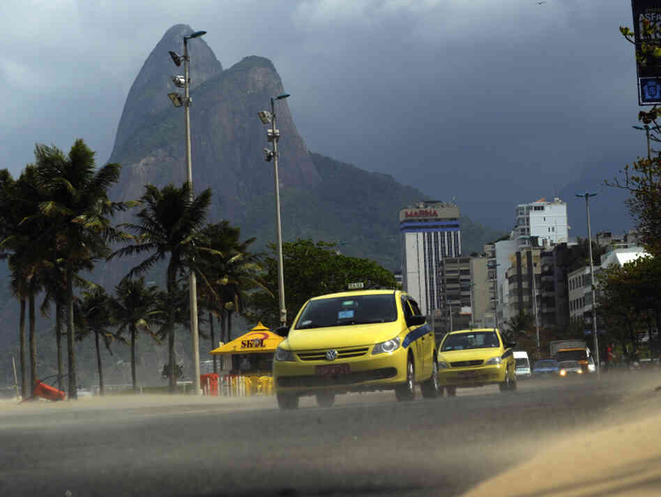Taxis drive along Vieira Souto Avenue in Taxis drive along Vieira Souto Avenue in