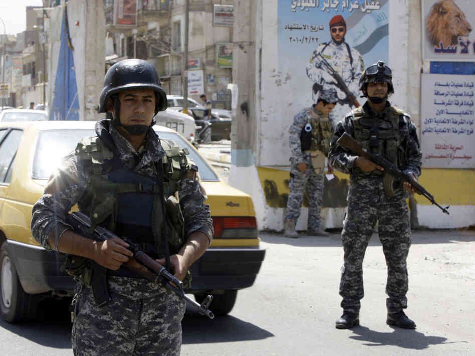 Iraqi soldiers man a checkpoint in Baghd Iraqi soldiers man a checkpoint in Baghd
