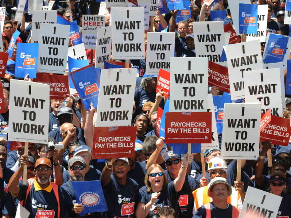 Union members hold up Union members hold up