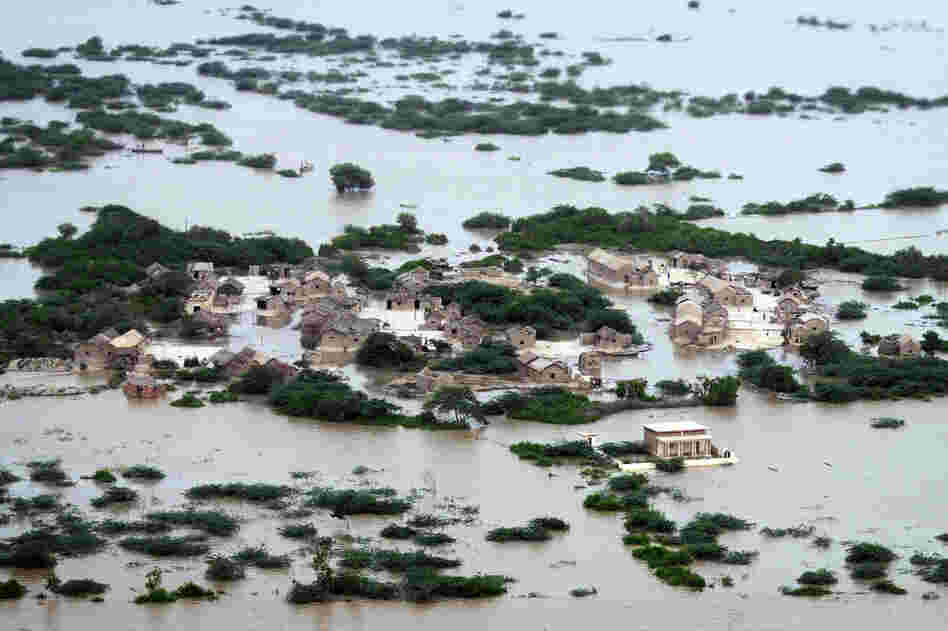 An aerial view shows the flooded Kharo Chan village in Pakistan's Sindh province on Aug. 25. The United Nations has described the widespread flooding in Pakistan as unprecedented, with more than one-third of the nation underwater. Officials say as many as 20 million people have been affected during Pakistan's worst flooding in 80 years. 
