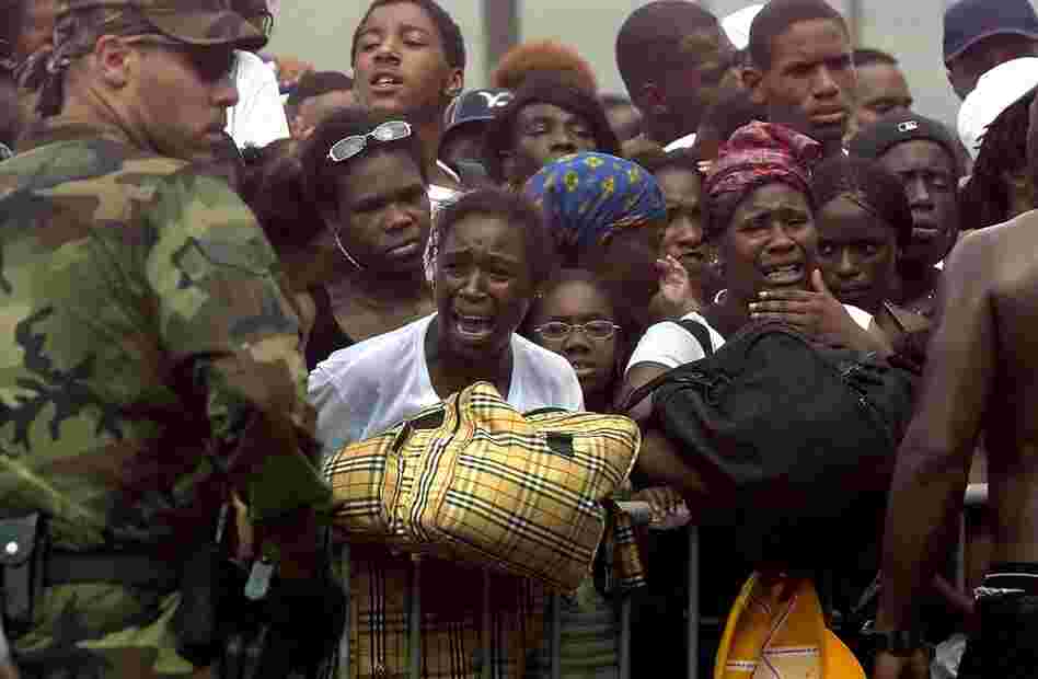 Victims of Hurricane Katrina argue with National Guard Troops as they try to get on buses headed to Houston on Sept. 1, 2005. Frustration was building as evacuees had been cooped up in the Superdome under very primitive conditions for days. 