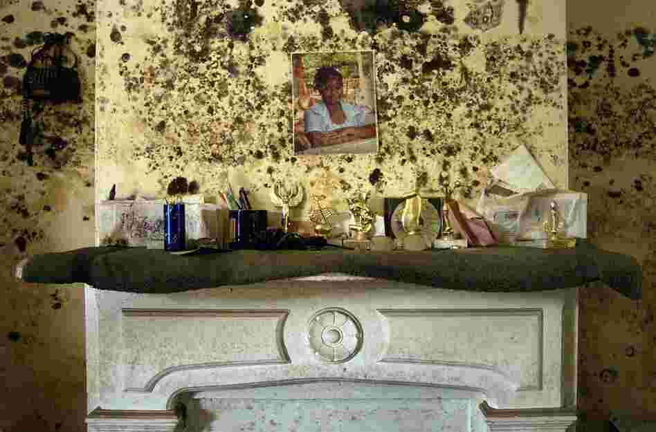 The mantle over the Robinson household in the ninth ward on Burgundy street shows the effects of the flood water on Oct. 12, 2005. There was little to save from the house that took over six feet of water from Hurricane Katrina. 