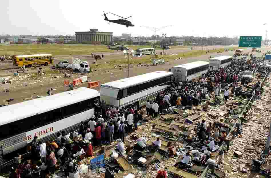 As some in dire need are airlifted out, others cram onto buses and wait to be evacuated from a refuge area at Causeway and I-10 in New Orleans on Sept. 3, 2005. 