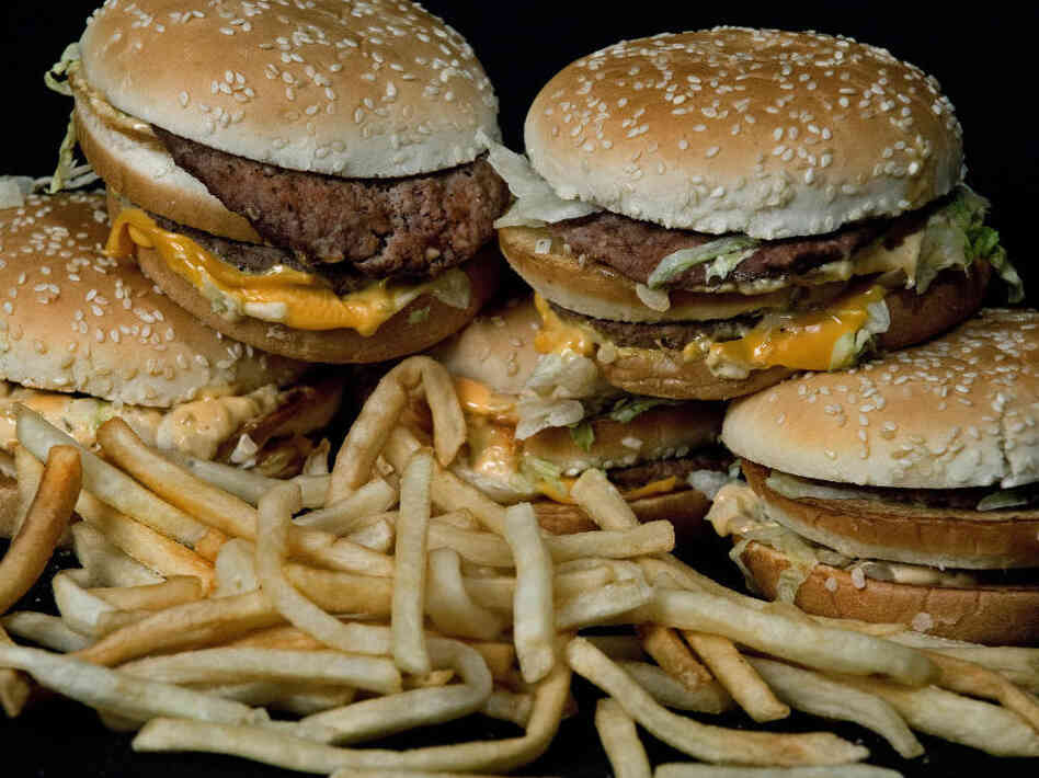 A stack of McDonald's Big Macs and Frenc A stack of McDonald's Big Macs and Frenc