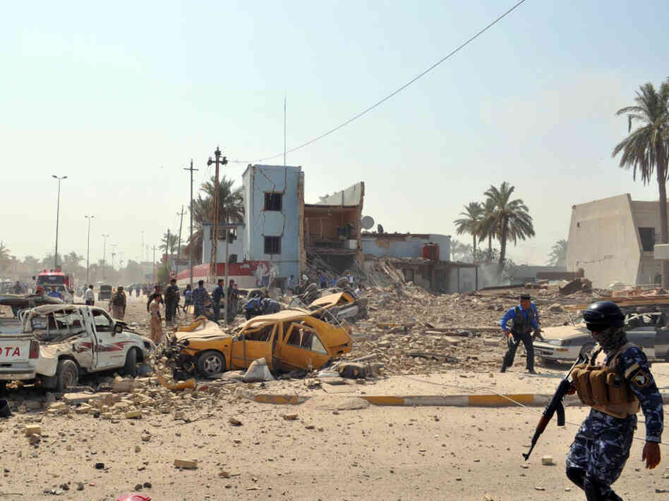 The collapsed buildings at the scene of The collapsed buildings at the scene of