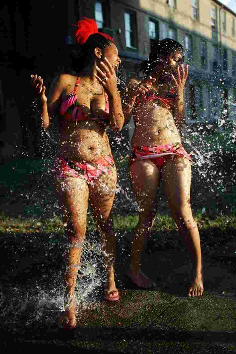 Residents of the B.W. Cooper housing project are splashed with water during a memorial birthday party Aug. 25, 2007. The party was in honor of 12-year-old Keith Franklin, who was accidentally shot and killed by a 13-year-old friend less than three weeks beforehand. The party also honored Keith's surviving twin brother, Kent.