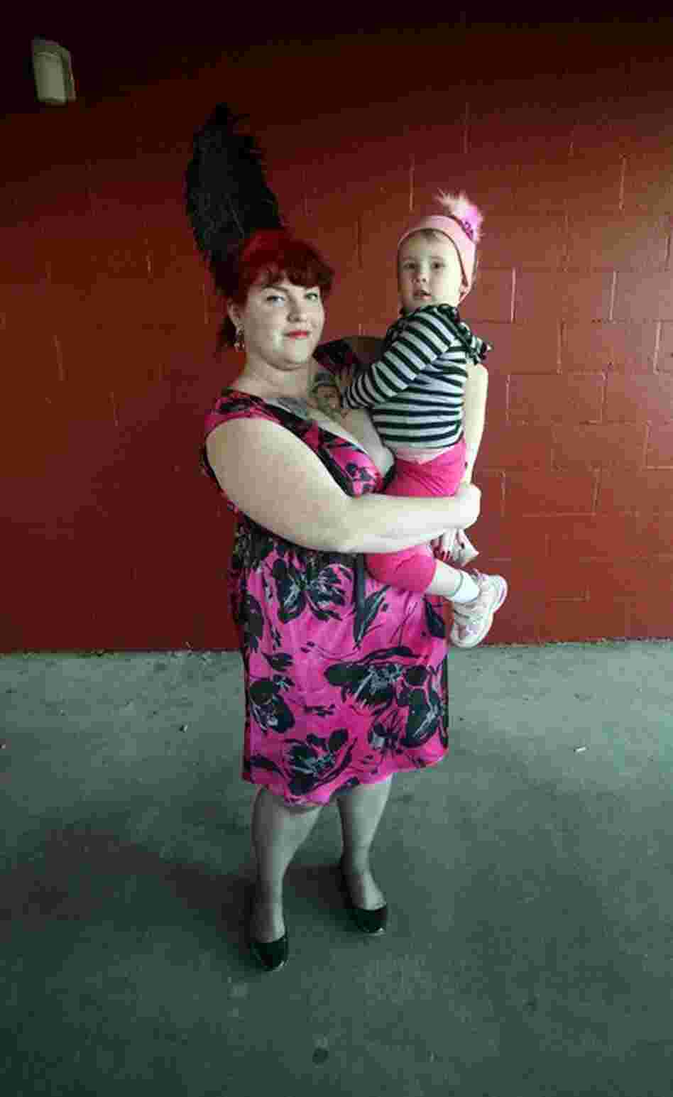 Jillian Bordelon holds Josie Bates while attending the Thanksgiving Day horse races at the Fair Grounds Race Track on Nov. 26, 2009. Each year people don their Thanksgiving finest and watch the races in an old New Orleans tradition.