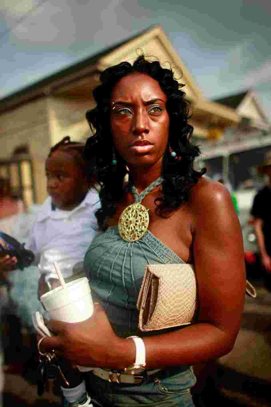 Coronda Thompson holds her baby Toronn Thompson at the Original Big 7 Social Aid and Pleasure Club traditional second line parade in the 7th Ward on May 10, 2009. The tradition sprang from when African Americans formed brass marching bands and fraternal groups to perform elaborate "jazz funerals" for their associates.