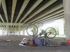 Ray McNair rests under I-95 in Overtown. Tom Ervin For NPR Ray McNair rests under I-95 in Overtown. Tom Ervin For NPR