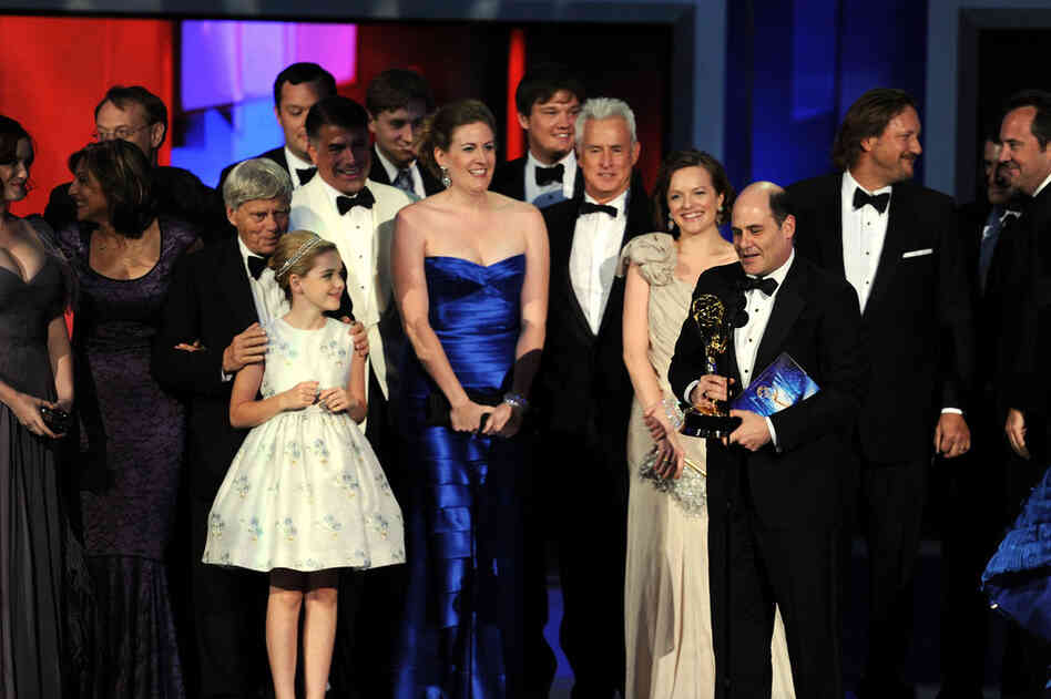 The cast of Mad Men accept the Outstanding Drama Series award onstage.  