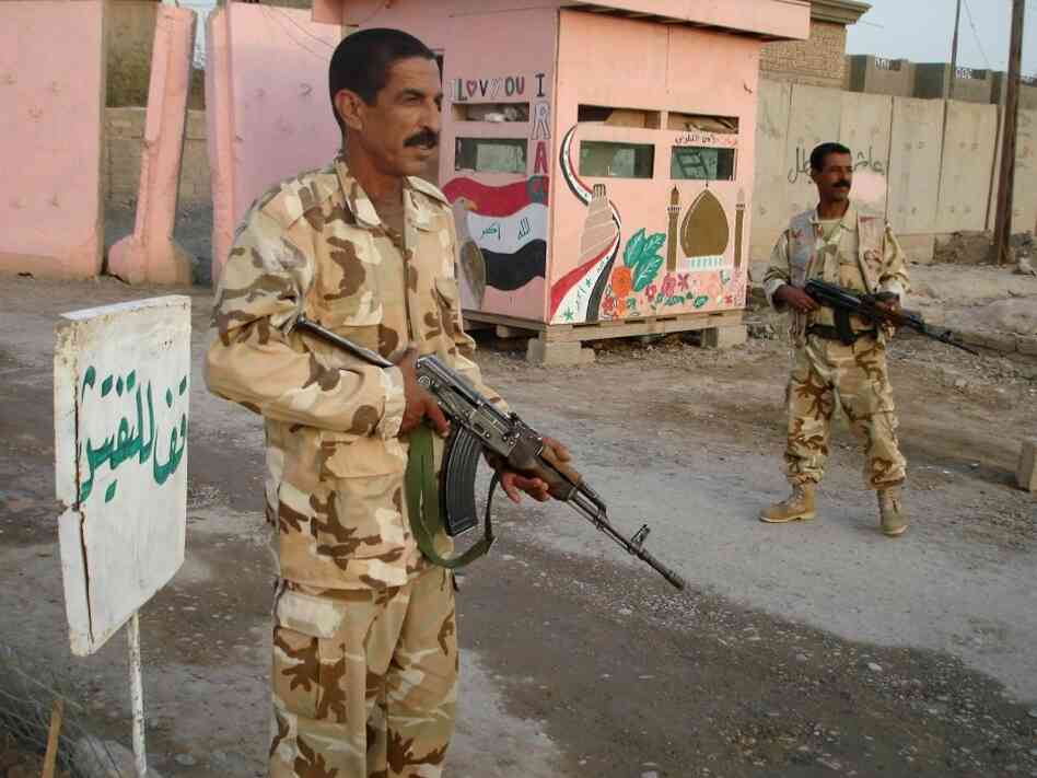 Members of the Sunni Awakening guard a checkpoint in Samarra, Iraq. Members of the Sunni Awakening guard a checkpoint in Samarra, Iraq.