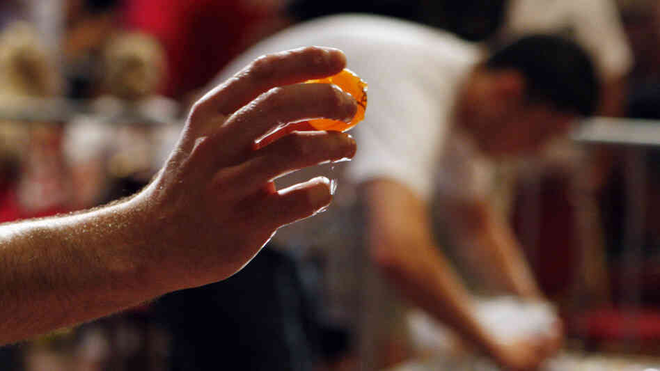 Man about to throw ping pong ball. Man about to throw ping pong ball.