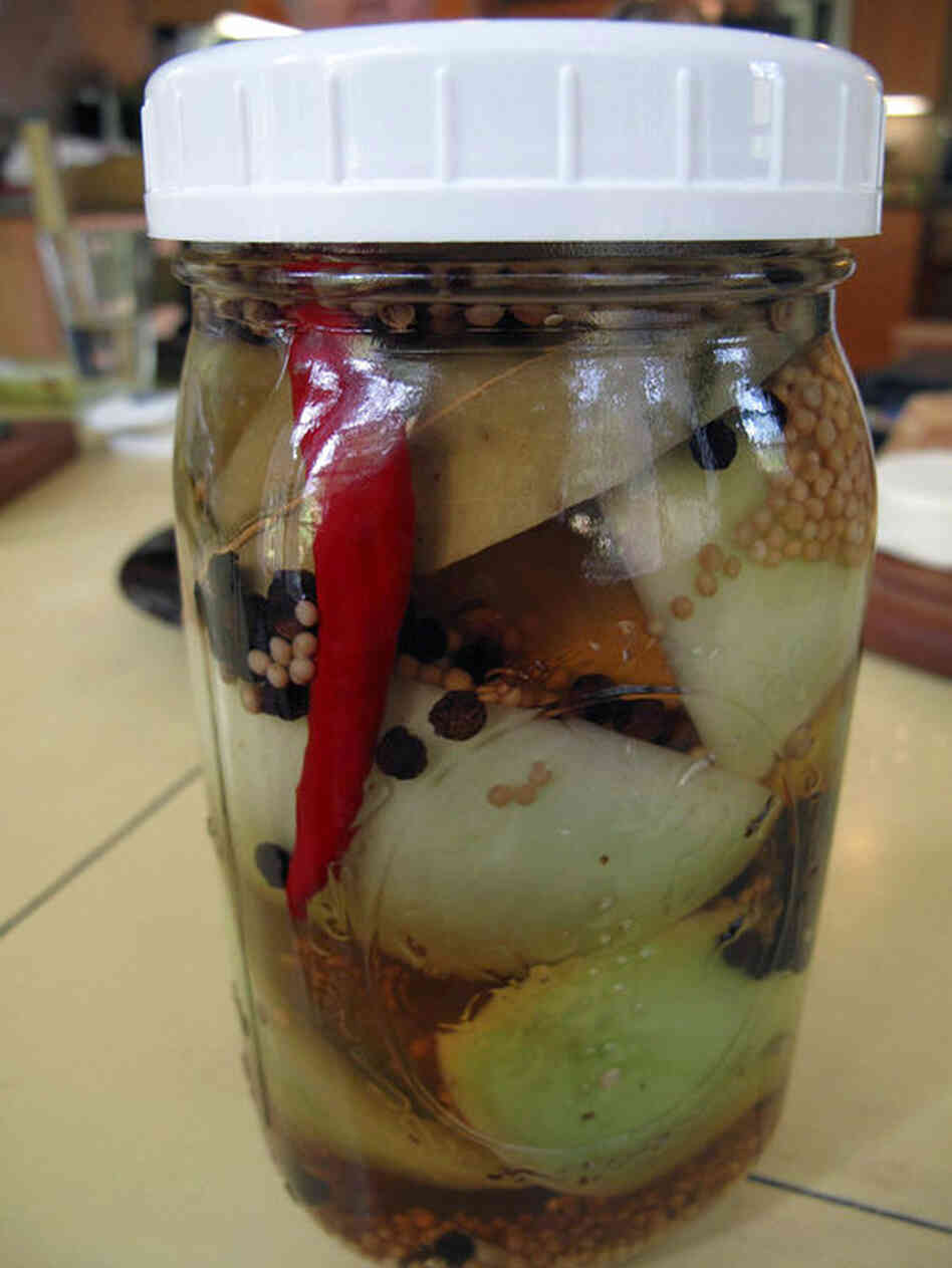A jar of pickled green tomatoes. "A lot of times, I'll just make one jar," Barrow says. Anyone heading out of town, she says, can take a ripe vegetable, "cut it up, put it in a jar, pour some brine over it and put it in the refrigerator."