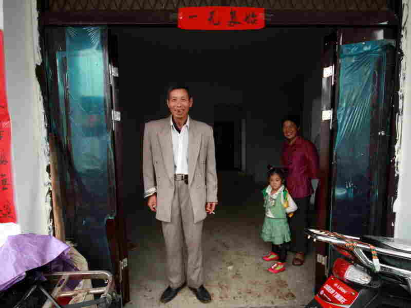 "I'm quite happy," says Zhang Sihua about his new house. "We will get used to it." "I'm quite happy," says Zhang Sihua about his new house. "We will get used to it."