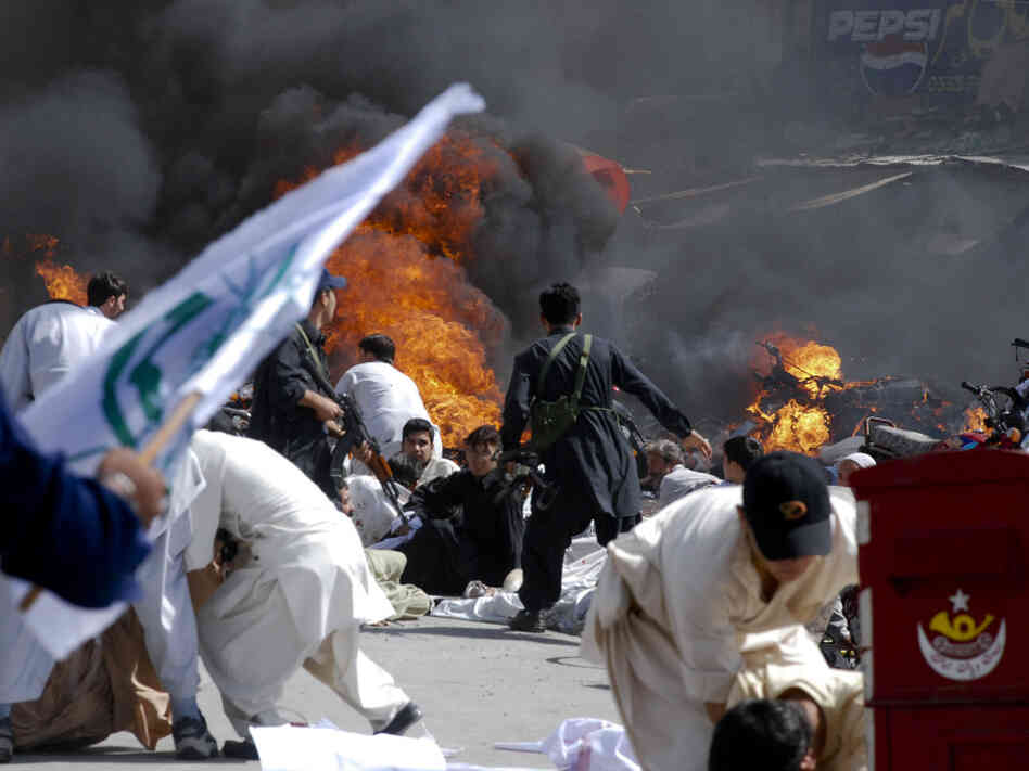 In Quetta, Sept. 3, people scramble to safety after a bomb attack. In Quetta, Sept. 3, people scramble to safety after a bomb attack.