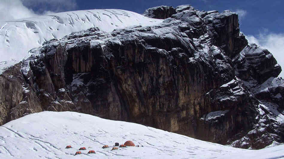 Base camp sits below a massif bearing one of the upper ice fields. Base camp sits below a massif bearing one of the upper ice fields.