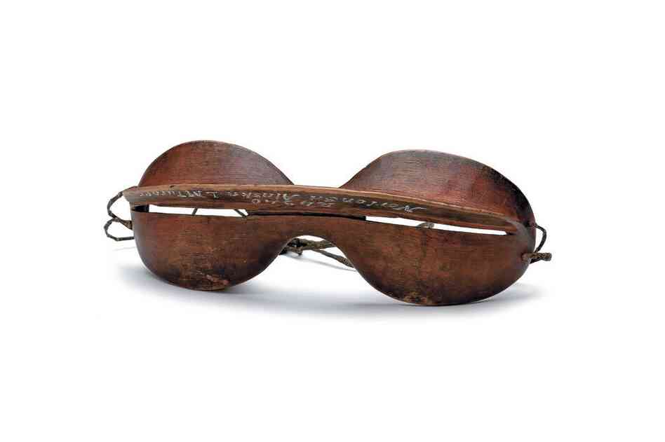 Inupiaq snow goggles. Ultraviolet light reflected from snow harms the retinas of the eyes, causing severe pain and temporary blindness. These elegant wooden goggles with narrow slits protected the eyes against sun and snow glare.