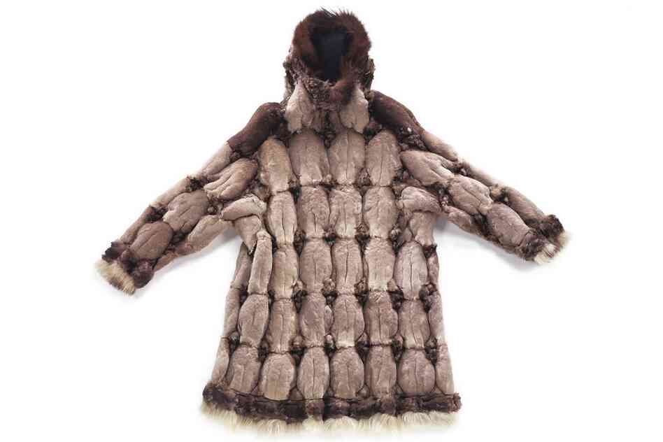 St. Lawrence Island Yupik bird-skin parka. This warm, lightweight parka is made from 85 crested auklet skins with a guillemot skin at each shoulder and dog-fur trim. St. Lawrence Island women made these parkas from the skins of auklets, ducks, cormorants, murres, loons and puffins.