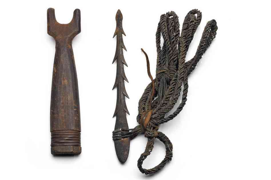 Haida harpoon head and cedar sheath. Harpoons were tipped with a point made of bone or iron. A plaited seaweed cord linked the harpoon head to the shaft.