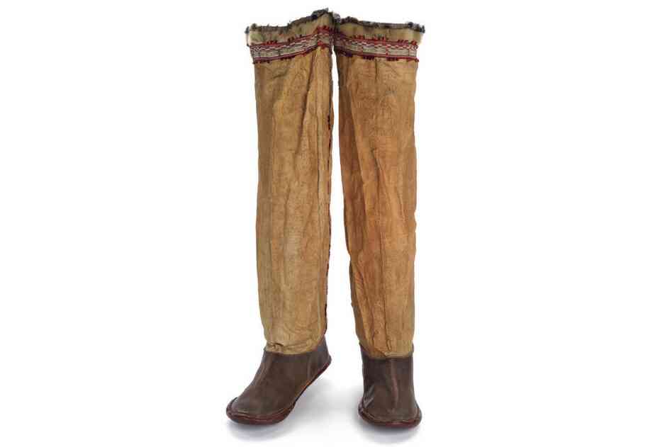 Unangax boots. These chief's boots were made from bleached seal throats, with dyed-membrane applique and topped with fur seal. The boots were sewn with whale or caribou sinew, which swelled when wet to make the seams completely watertight.