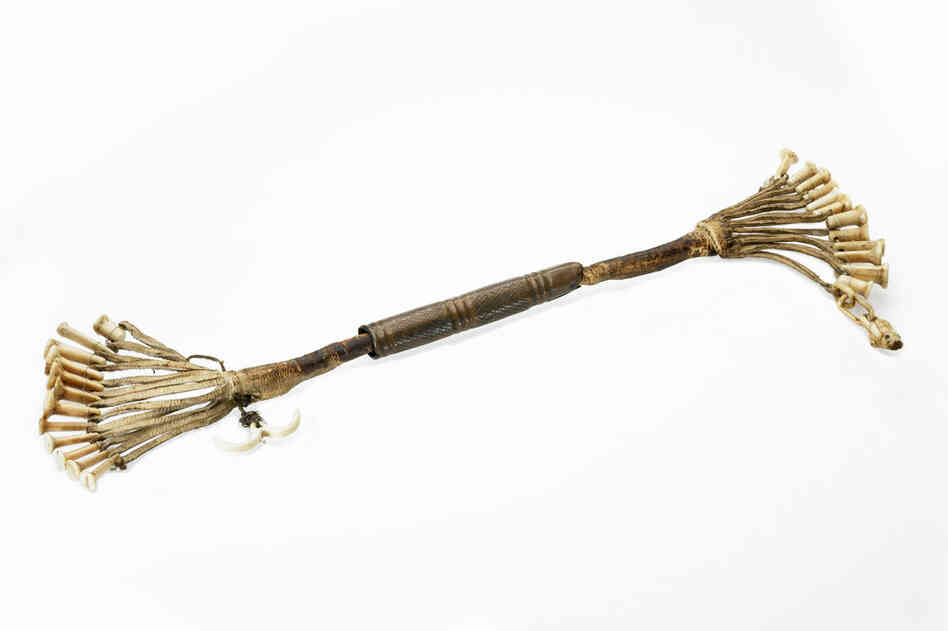 Inupiaq needle case. Early Alaskans depended on needles to sew the warm, watertight clothing needed to survive in the arctic. A woman kept her sewing needles on a leather strap inside a sliding tube. Different needles were used for sewing tough seal hide, fur and delicate gut membranes.