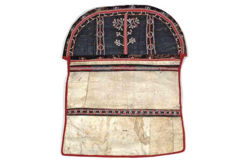 Sugpiaq sewing bag. Sewing was an essential skill and one of a woman's most important assets for marriage. Women kept their sewing materials, including thread made of sinew, in pouches like this one made of bleached seal throats and painted skin with caribou-hair embroidery.