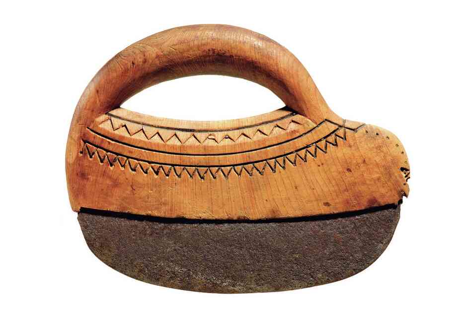 Unangax woman's knife. This knife was used for cutting hides, meat and blubber and is similar to knives used today across the arctic. Knives like these were also used to split seagull bones into fine slivers to make needles.
