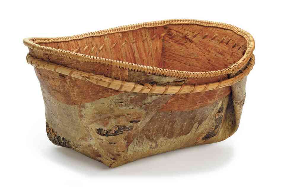Athabascan basket. Baskets like this one made of birch bark and reinforced by a double rim of bentwood hoops were made to hold water and store foods such as berries, fish, oil and bear grease. Soups and stews were cooked in them by adding hot stones.