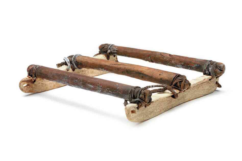 St. Lawrence Island Yupik boat sled. This small, traditional sled was for hauling hunting boats over sea ice to open water. This one is made of wood with walrus tusks for runners.