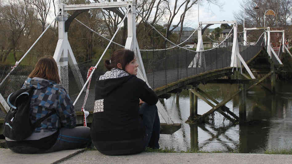 Two girls near a buckled foot bridge south of Christchurch, New Zealand. Two girls near a buckled foot bridge south of Christchurch, New Zealand.