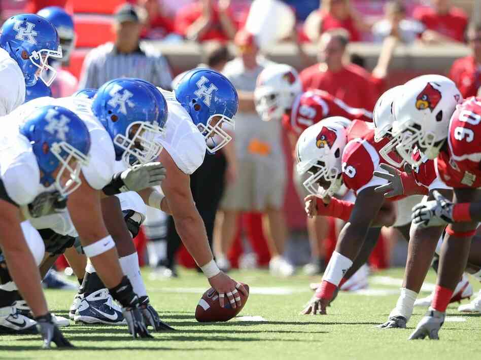 Kentucky and Louisville square off at the line of scrimmage. Kentucky and Louisville square off at the line of scrimmage.