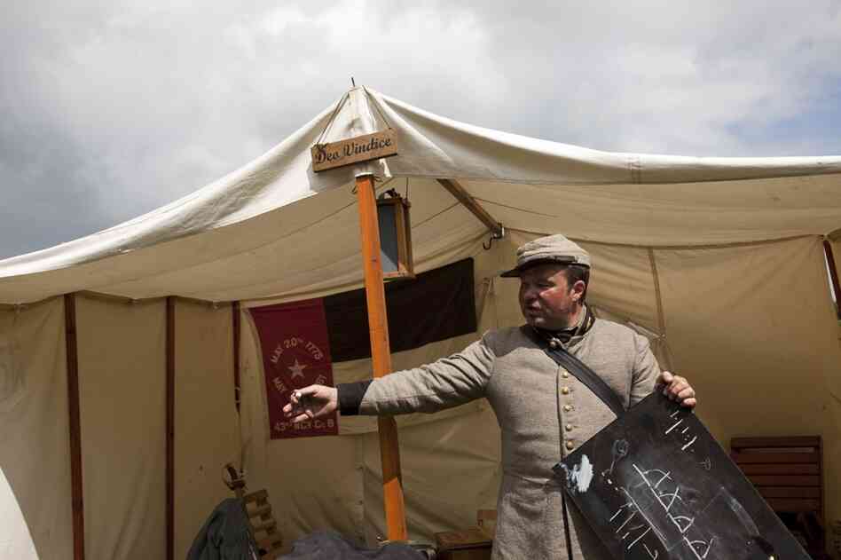 18th Virginia Company G 1st Lt. Darren Bond discusses strategy in a meeting with fellow Confederate re-enactors.