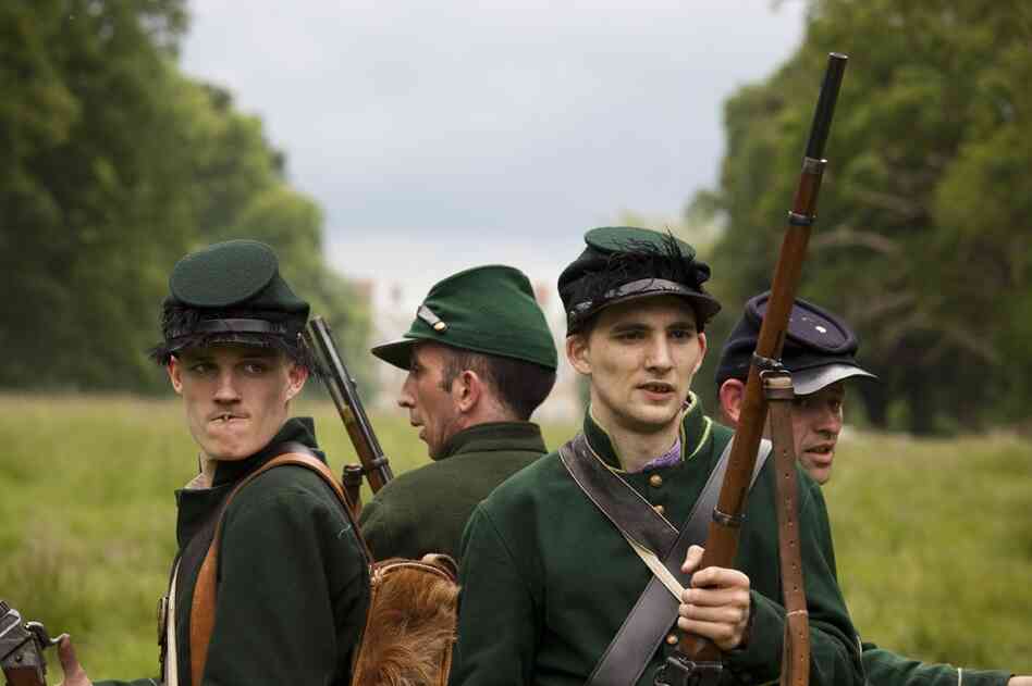 Members of the U.S. Sharpshooters band together during a private American Civil War Society battle at Stanford Hall in Leicestershire, England.
