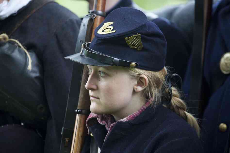 69th New York Infantry Pvt. "Chris Smith" stands in formation with her unit.