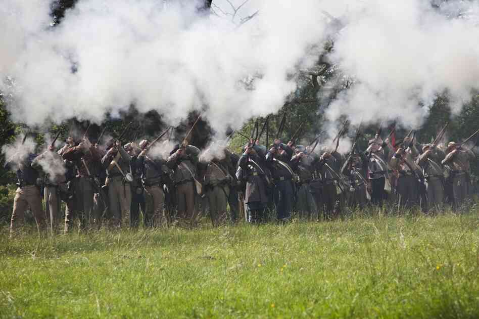 The Confederate Army fires for an audience following a re-enactment for the public at Stanford Hall.