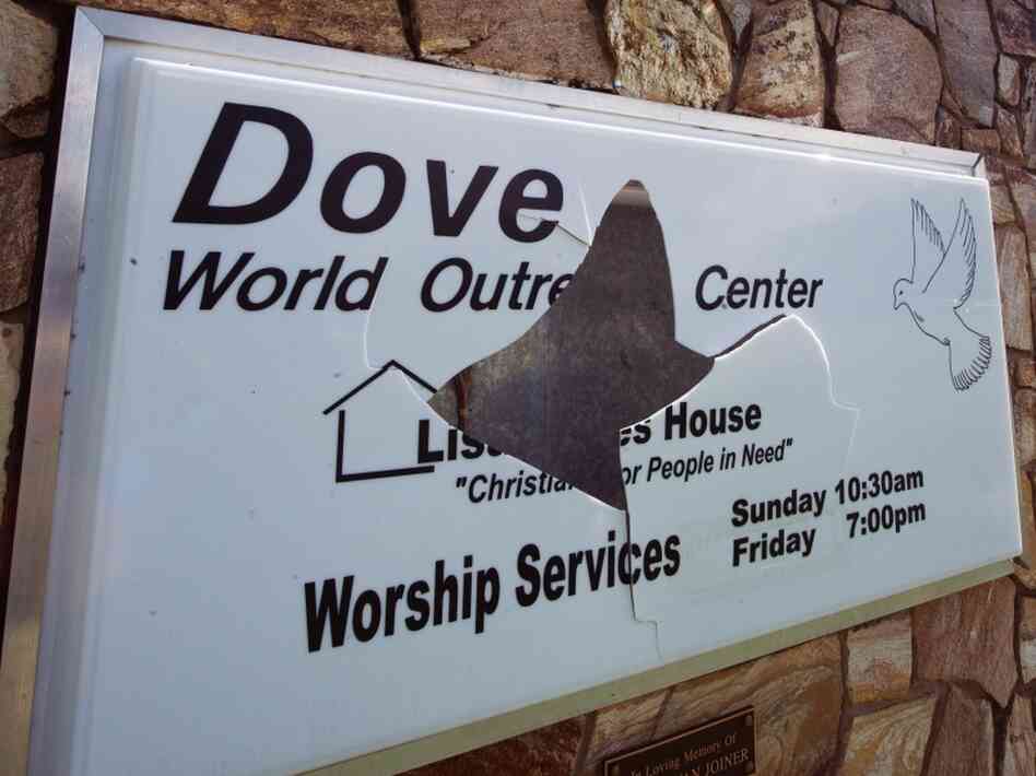 A vandalized sign at the Dove World Outreach Center A vandalized sign at the Dove World Outreach Center