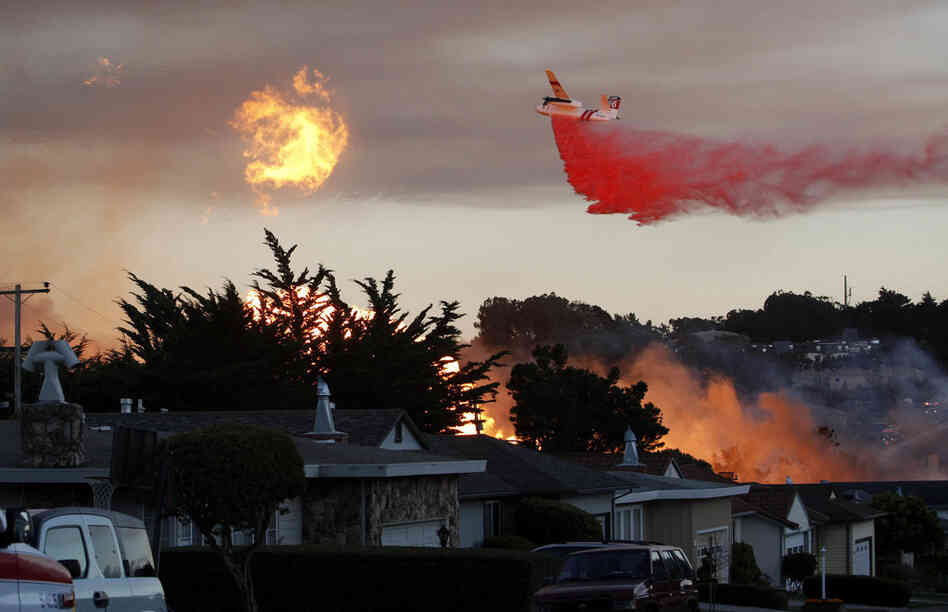 Firefighters from San Bruno and surrounding cities battle the blaze that started on a hillside. 