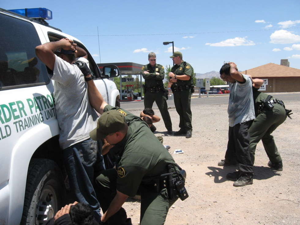 Border patrol agents arrest immigrants in 2007 who had recently crossed the border from Mexico into Nogales, Ariz. Federal programs like Operation Streamline put border-crossers without other prior criminal records through the federal court system.