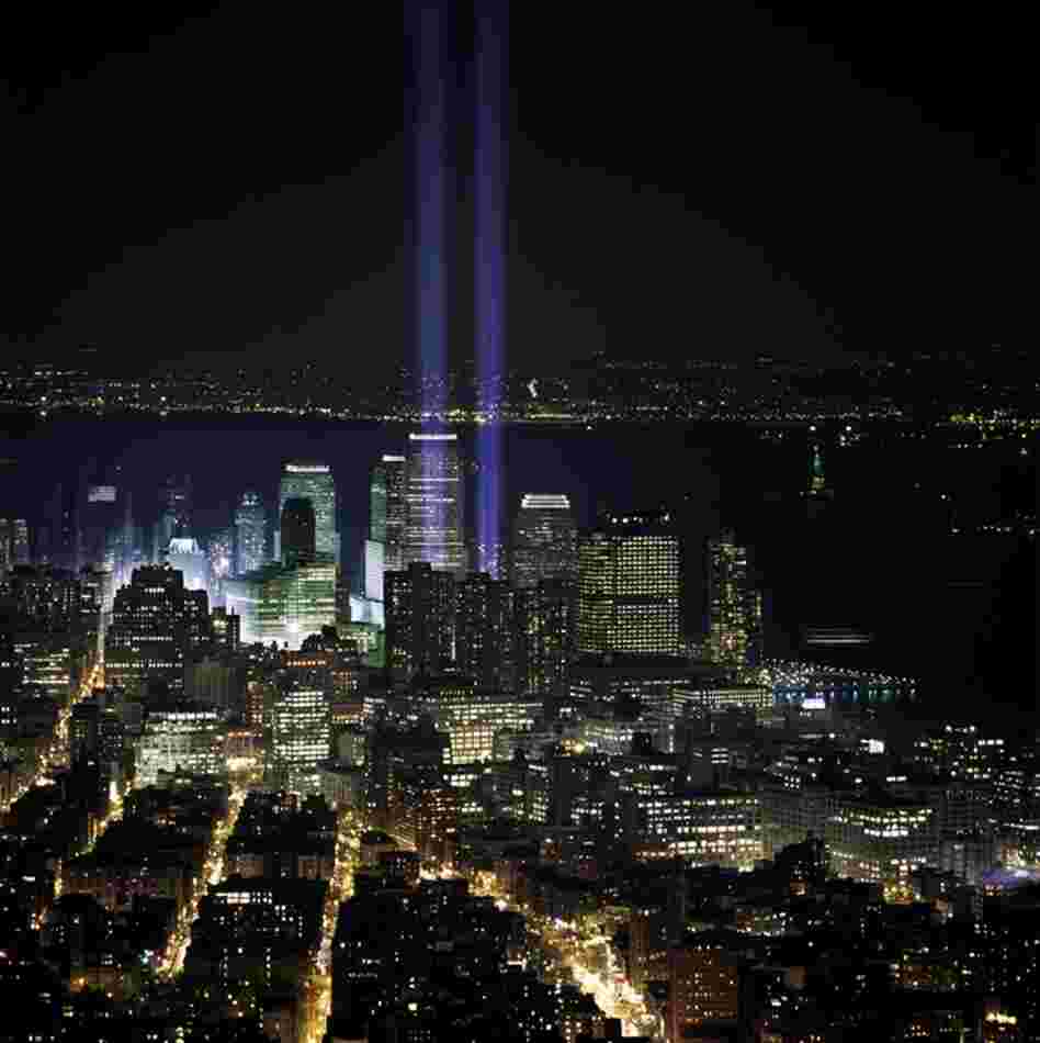 Six months after the fall of the twin towers, two beacons of blue light rise beyond Tribeca as a memorial. March 11, 2002