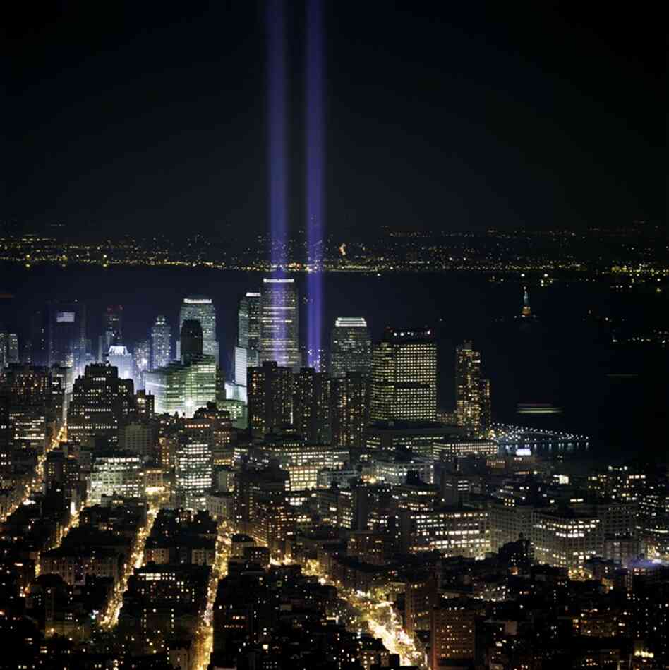Six months after the fall of the twin towers, two beacons of blue light rise beyond Tribeca as a memorial. March 11, 2002