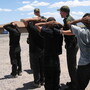 Border Patrol arrests migrants in 2007 after they illegally crossed the border into Nogales, Ariz.