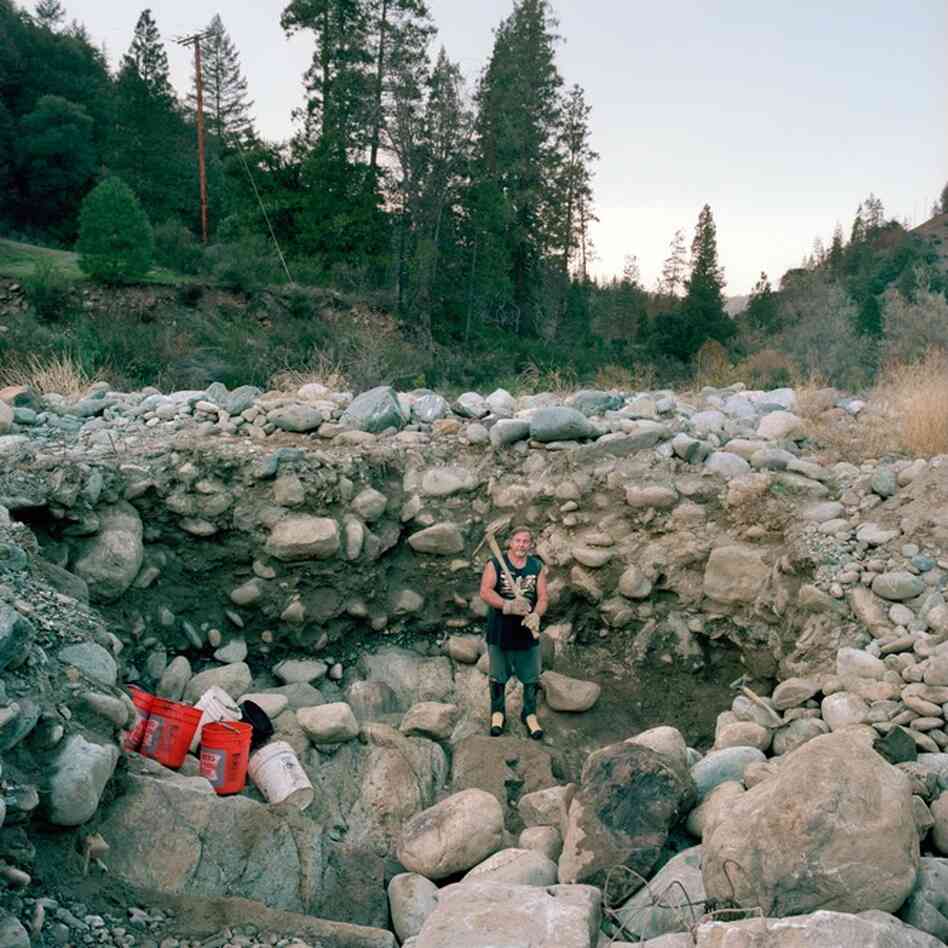 Prospector Avery Rathburn at his digging site along Scott River, Klamath National Forest, Calif.
