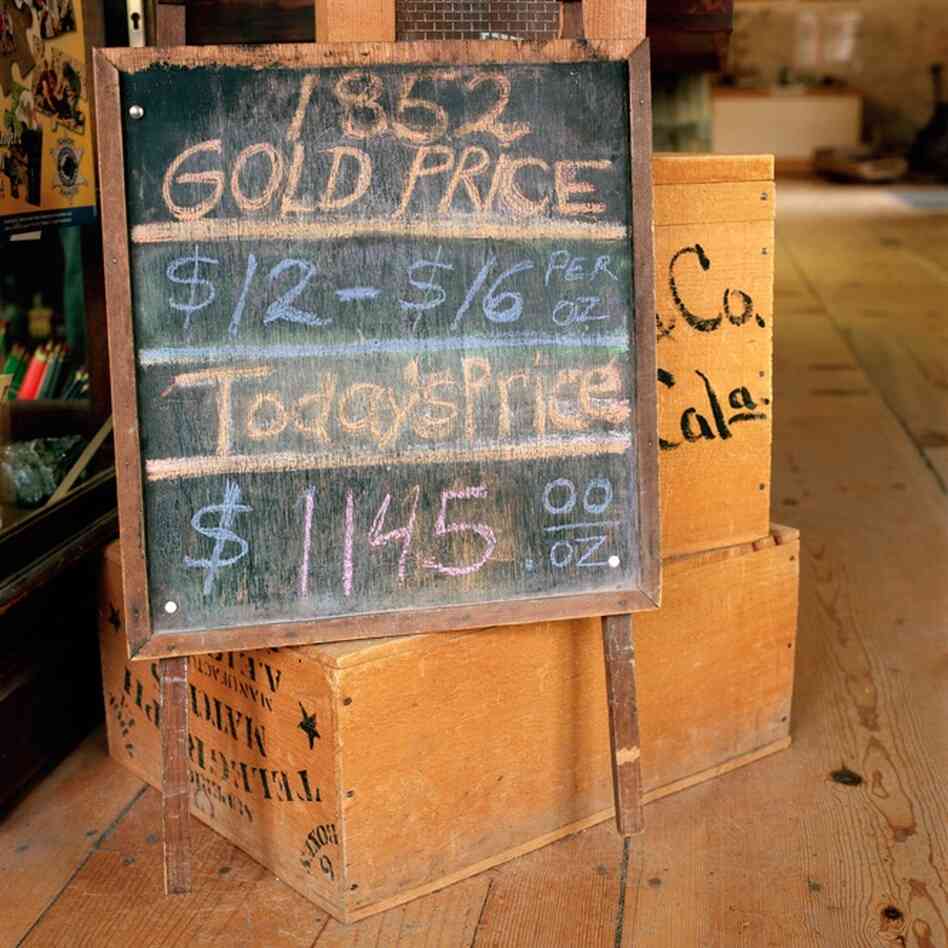 A chalkboard lists the price of gold on November 20, 2009: $1145/ounce –  as compared with the 1852 price of gold: $12-16/ounce. Updated daily, this chalkboard is located inside the Columbia History Museum in Columbia, Calif.
